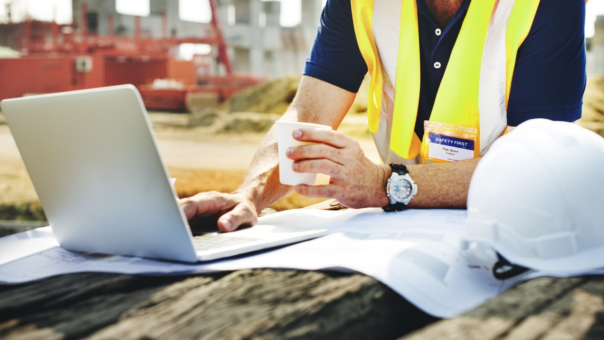 Construction project manager on a laptop